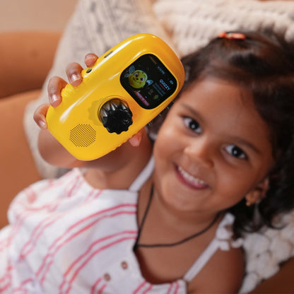 A smiling girl holding Cheeko to her ear while playing a quiz
