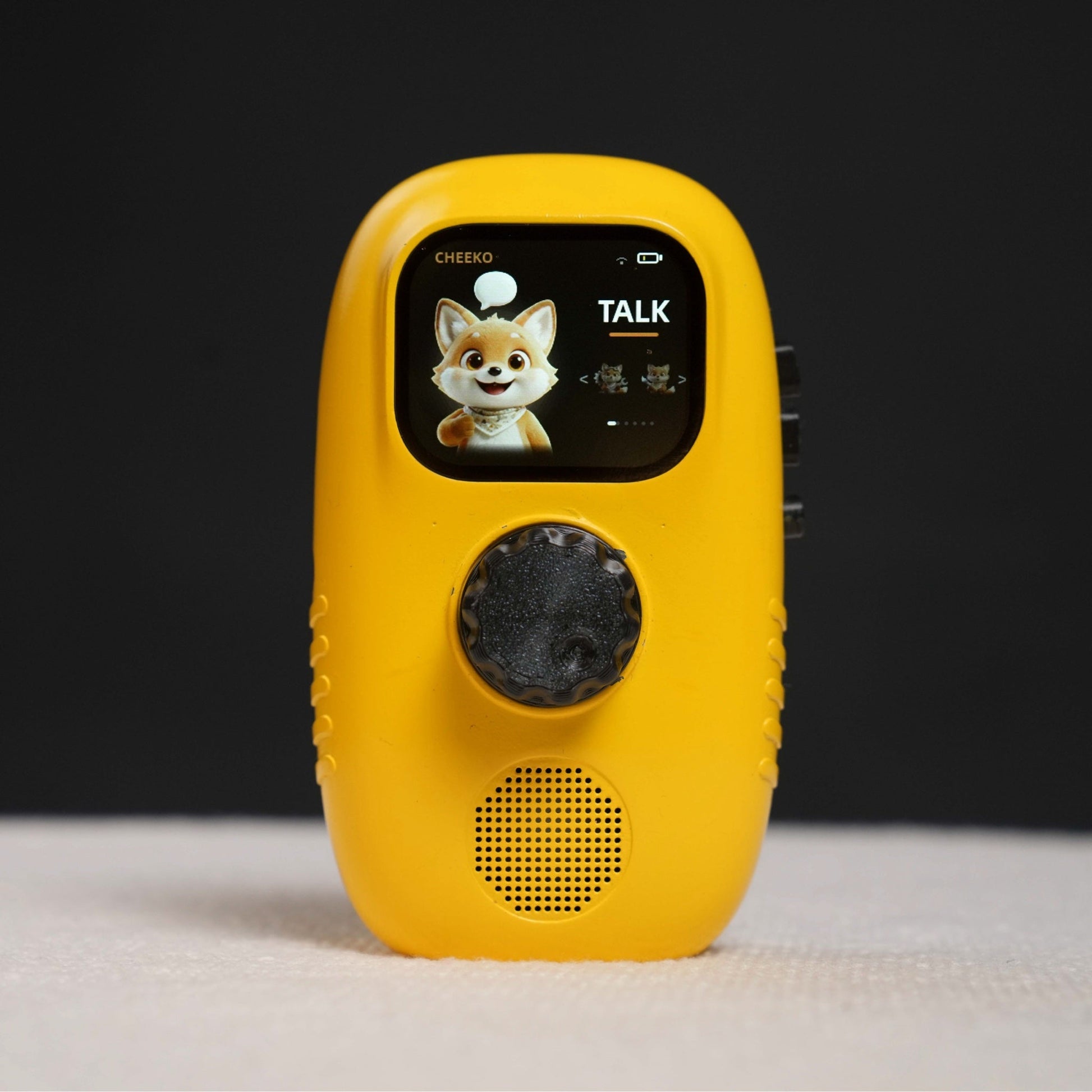 The yellow Cheeko device showing the Talk screen with the fox character